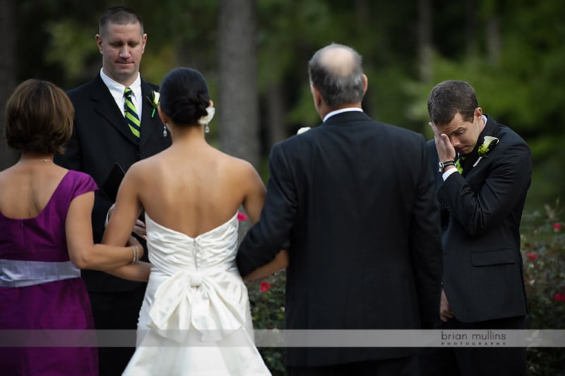 groom crying at wedding