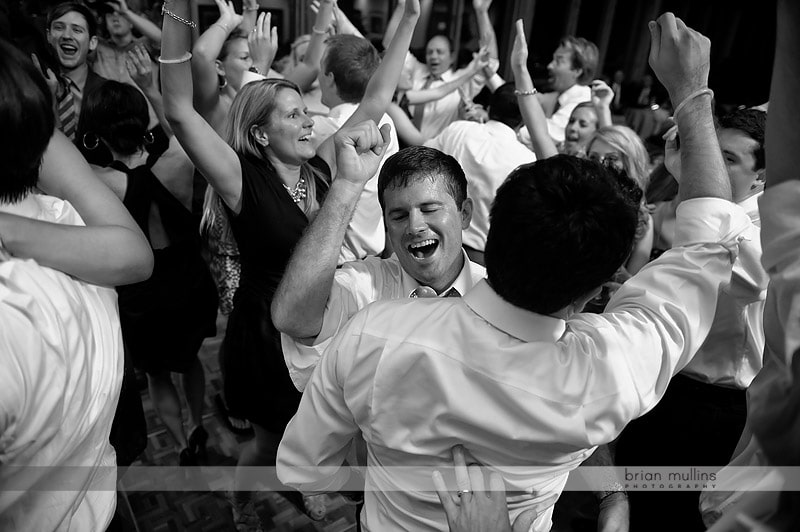 groom getting mobbed at wedding reception