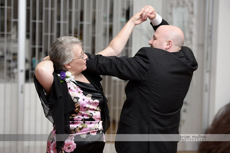 groom dancing with mother