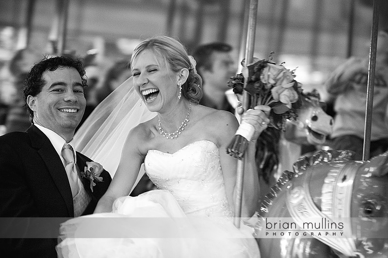 bride and groom on carousel