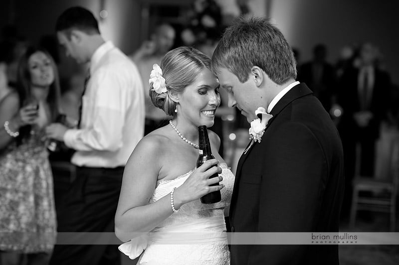 bride and groom share a tender moment