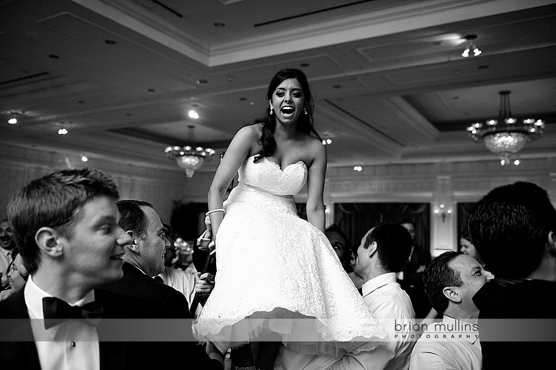 bride in chair during hora