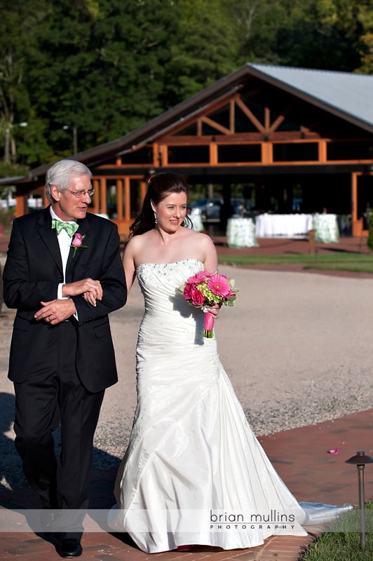 bride walking with father at wedding