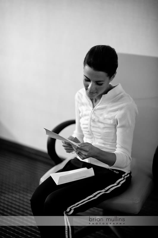 bride reading card from groom before wedding