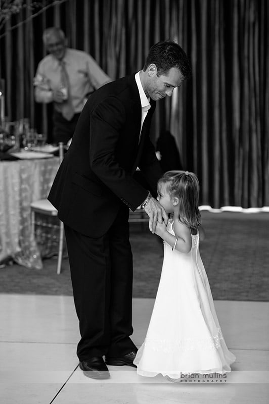 groom dances with young daughter