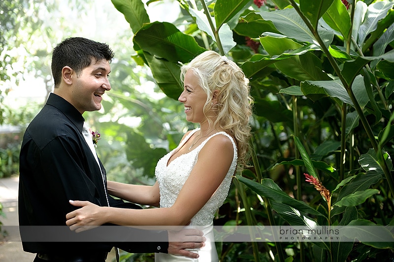 bride and groom in butterfly garden