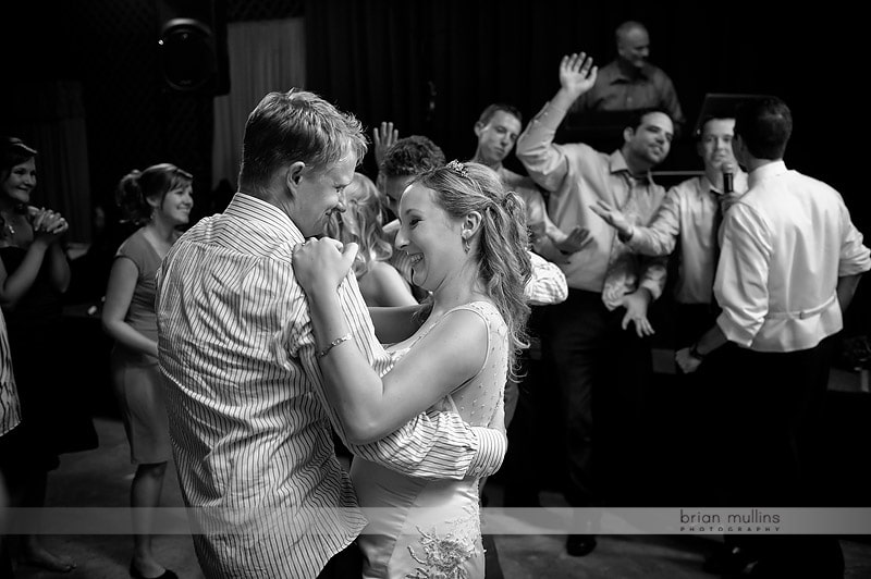 groom serenading bride