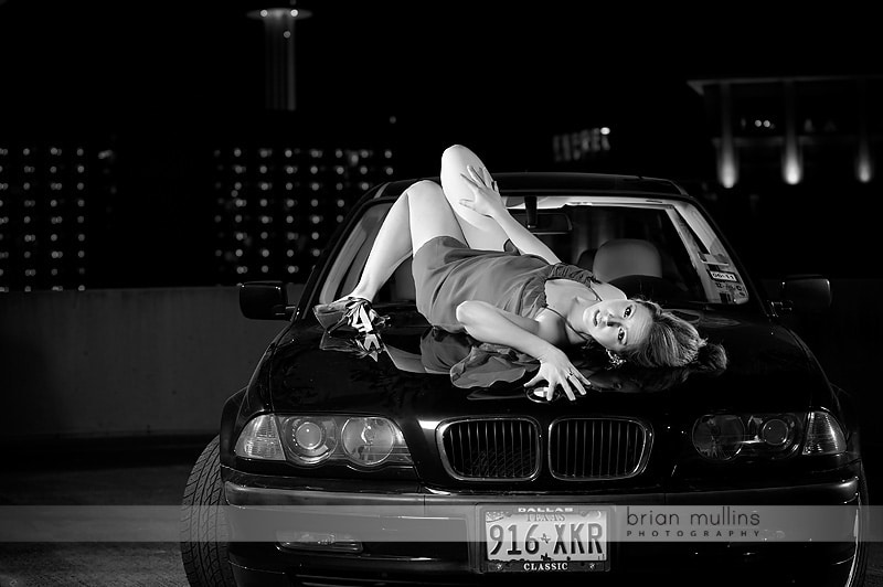 girl laying on car