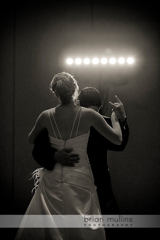 groom gives devil horns at wedding reception