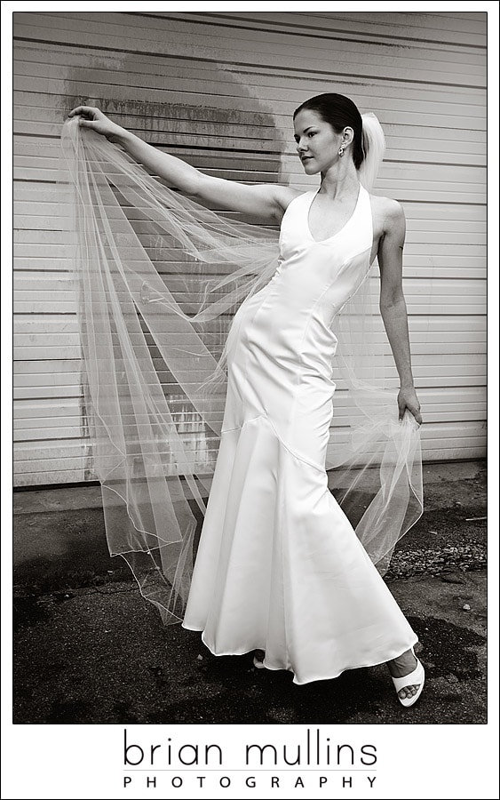 B&W photo of bride with veil