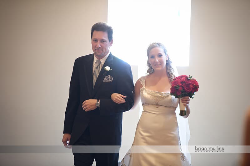 bride walking down aisle with dad at st andrews wedding