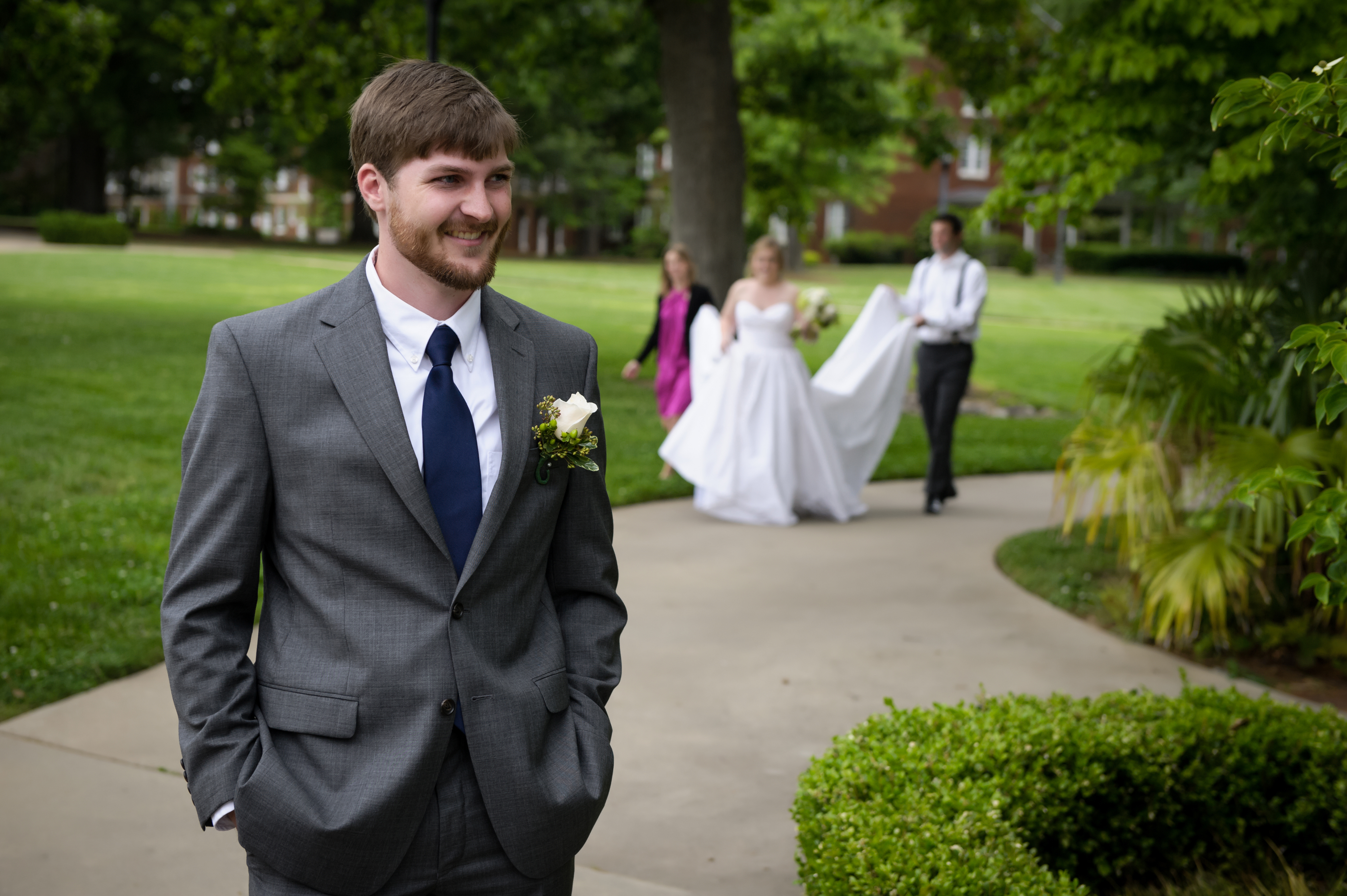 bride sneaking up on the groom at meredith college