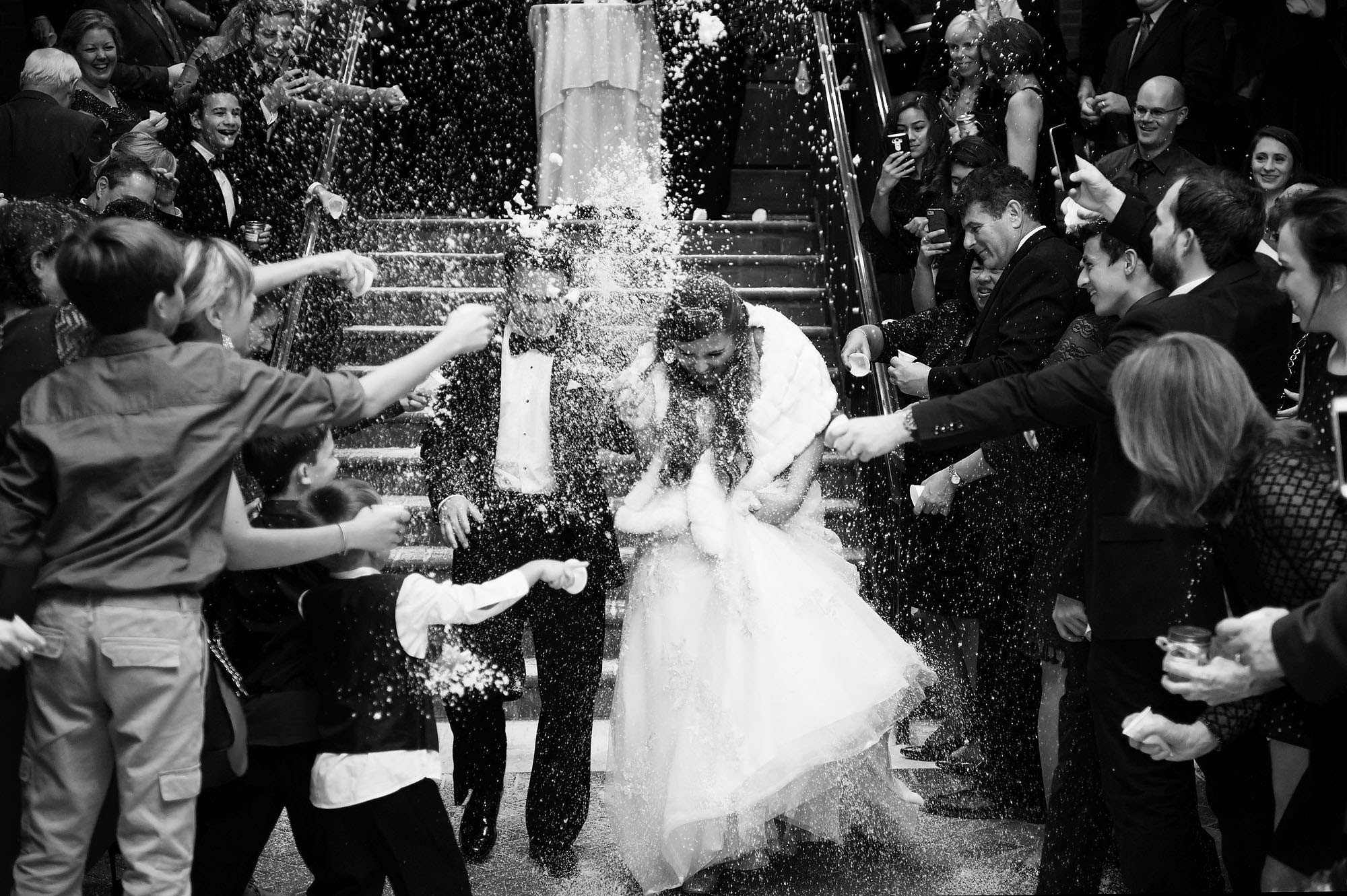 a snow throwing wedding exit at the prestonwood country cub