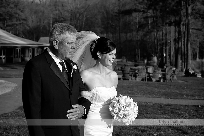 father walking daughter down aisle