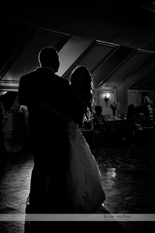silhouette of bride and groom dancing