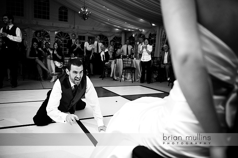 funny groom garter removal - Raleigh Wedding Photographer