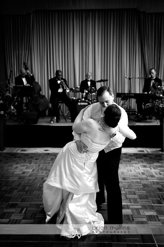 groom dipping bride