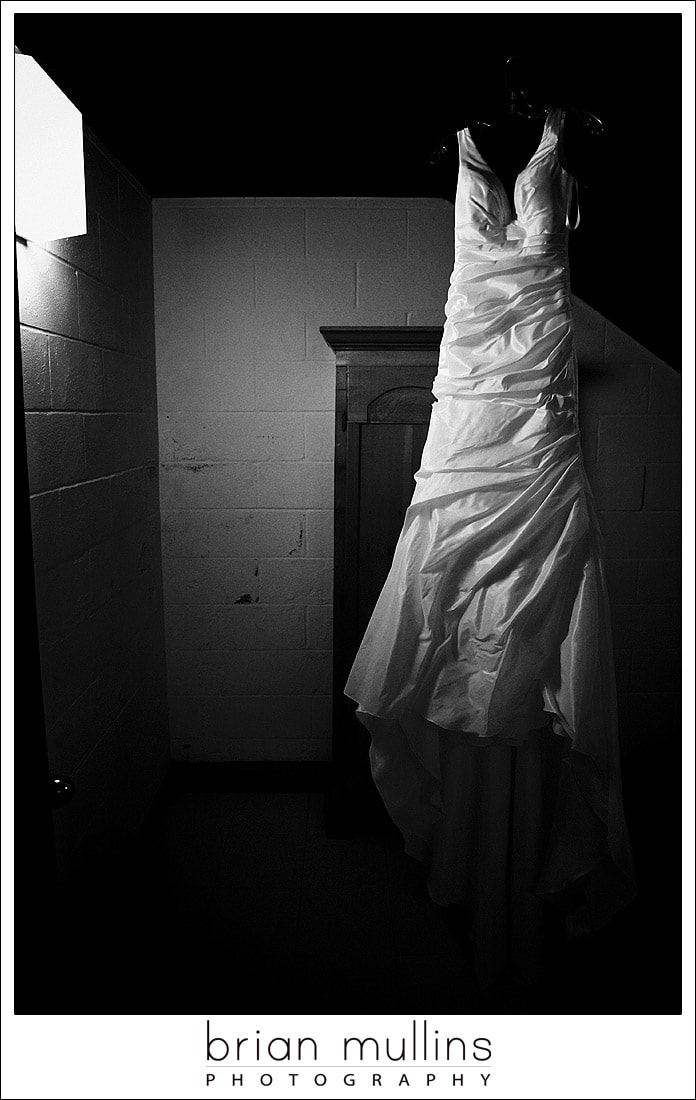 Wedding dress hanging in stairwell