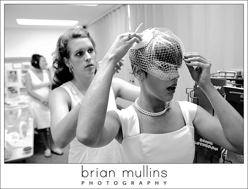 Bride putting on a birdcage