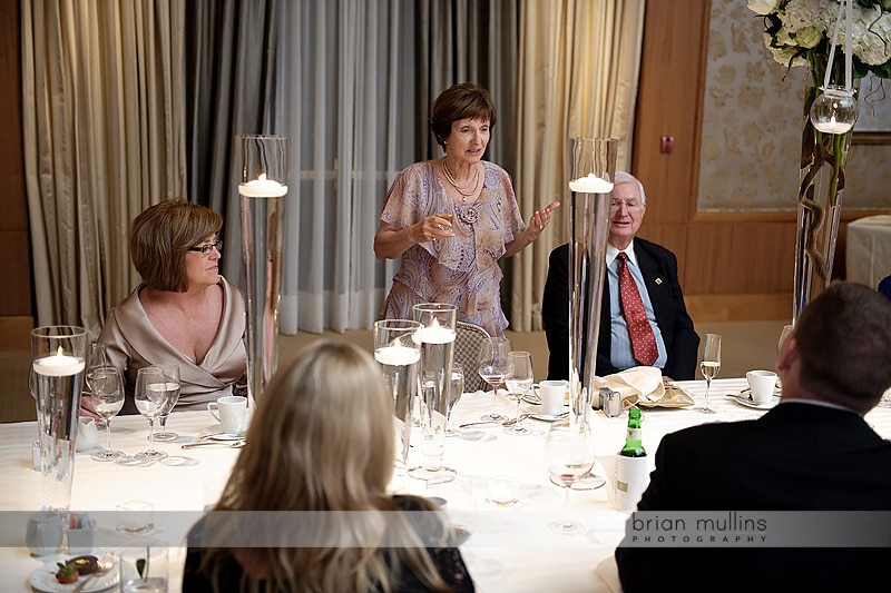 mom giving toast at wedding reception