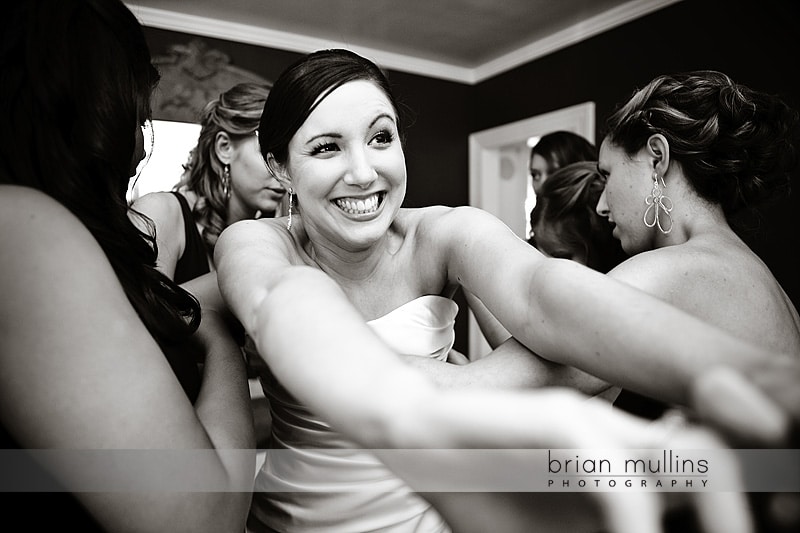 Raleigh Wedding Photography - bride putting on dress