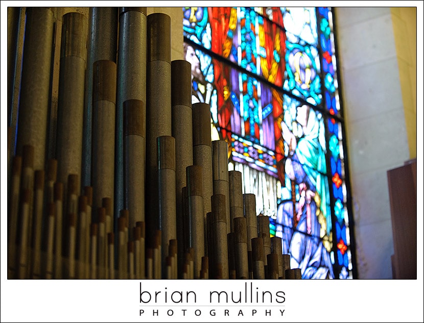 organ pipes and stained glass window iN Sacred Heart Cathedral