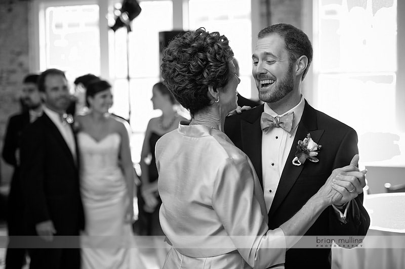 groom dancing with mother