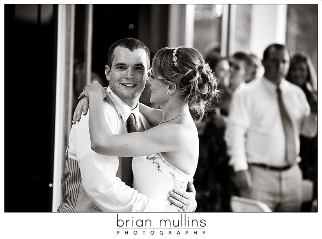 Married couple enjoying first dance at wedding reception