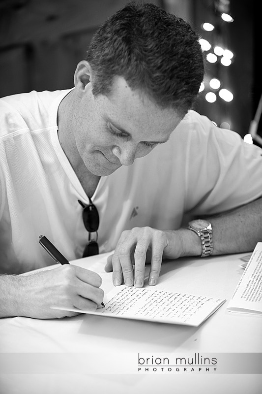 groom writing wedding note to bride