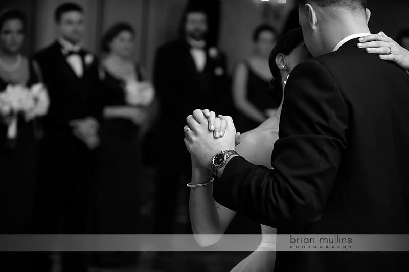 bride and groom holding hands