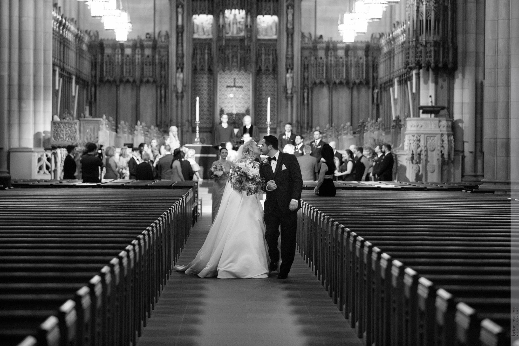 duke chapel wedding ceremony couple walking down aisle